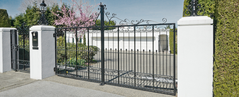 Stylish iron automated gates at a property entrance in Somerset